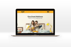 Nolah website design mocked up on macbook pro