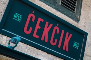 Exterior close up shot of Cekcik hand painted sign in Valletta