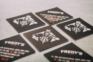 Close up shot of printed business cards for Fredy's Diner